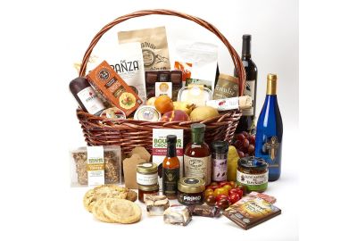 Elegant gift basket with a bottle of champagne, gourmet snacks, and a variety of nuts and dried fruits.